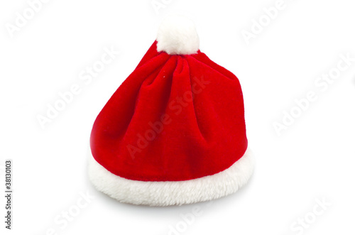 Photo: Red Santa Claus hat on white background . Red Santa Claus hat on white background .