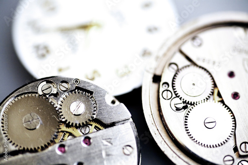 Photo: Old metal mechanical clock with gear wheels Old metal mechanical clock with gear wheels