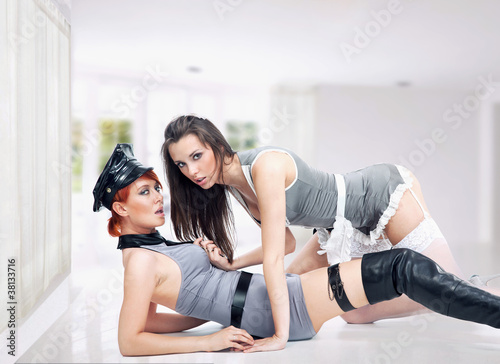 Photo: Cleaning maid and a police woman Cleaning maid and a police woman