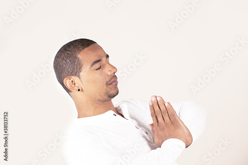 Photo: Man practicing yoga with lot of copy space Man practicing yoga with lot of copy space