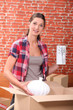 portrait of a woman with moving boxes