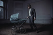Fashionable man with a perambulator