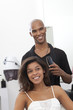 Woman getting her hair styled at beauty salon
