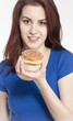 Young woman holding a donut