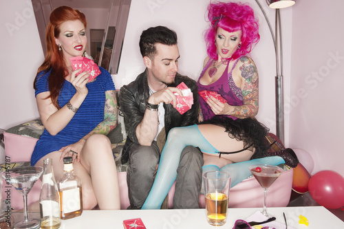 Photo: Woman seducing man while playing cards Woman seducing man while playing cards