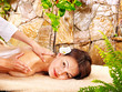 Young woman getting massage in spa. Young woman getting massage in spa.