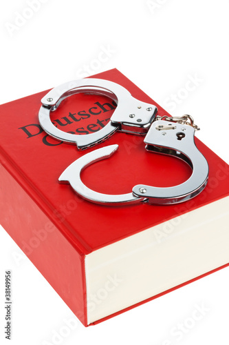 Foto: gestzbuch und Handschellen gestzbuch und Handschellen