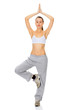 portrait of beautiful woman working out yoga exercise (tree pose
