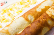 Pancake with marmalade, yogurt sauce and yellow fruits