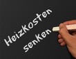 Tafel mit Hand - Heizkosten senken