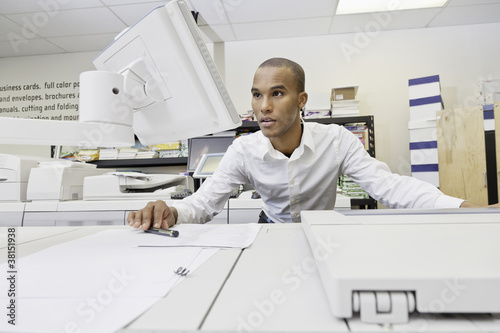 Photo: Man looking at visual screen Man looking at visual screen