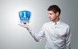 businessman holding virtual shield sign businessman holding virtual shield sign