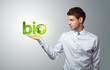 businessman holding virtual eco sign businessman holding virtual eco sign