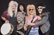 Group of cheerful musicians singing over black background