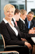 Business female boss - team in office
