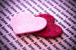 Photographie : The word LOVE typed many times and sparkly hearts