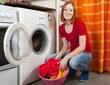 Young woman doing laundry