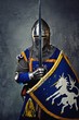 Medieval knight on grey background.