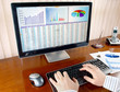 Male hands on the keyboard in front of computer screen