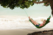 Beautiful women in the hammock on the beach