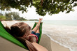 Woman relaxing on hammock