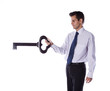 Businessman holding a giant key.. Businessman holding a giant key..