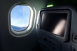 Photo: detail of airplane seat with tv screen detail of airplane seat with tv screen