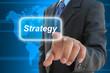 businessman hand pushing strategy button