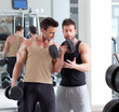 gym personal trainer man with weight training