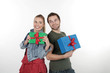 A happy couple give each other gifts A happy couple give each other gifts
