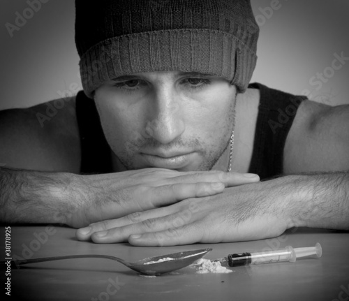 Photo: addict, a syringe, the drugs and heroin close up addict, a syringe, the drugs and heroin close up