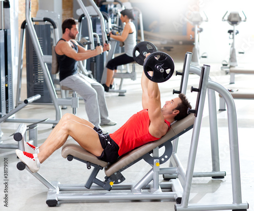 Photo: group with weight training equipment on sport gym group with weight training equipment on sport gym