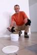 handyman going to put glue