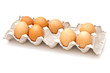 Brown eggs in a carton package on white background