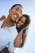 Couple stood outdoors on sunny day