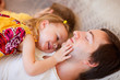 Father and daughter relaxing in hammock