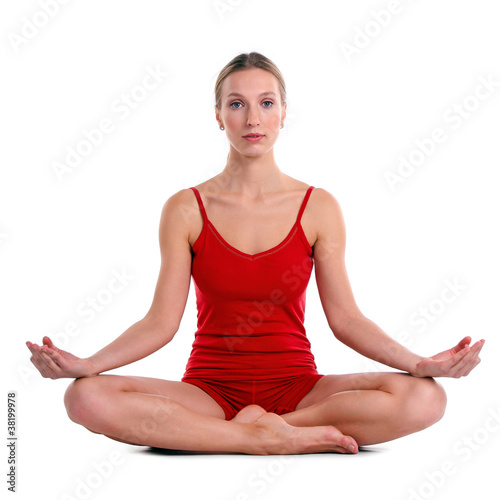 Photo: Young woman practicing yoga in the lotus position Young woman practicing yoga in the lotus position