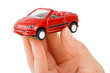 Hand and toy car