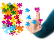 hand touching abstract puzzle piece
