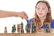 Photo: Girl watching player make chess move Girl watching player make chess move