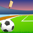 Soccer ball on green field of the stadium