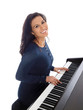smiling teenage girl playing piano