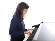 smiling teenage girl playing piano