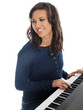 smiling teenage girl playing piano
