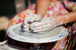 hand on a potter wheel at the fair