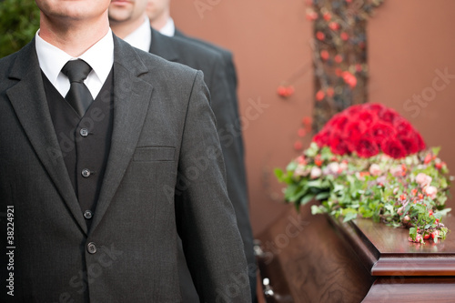Photo: coffin bearer carrying casket at funeral coffin bearer carrying casket at funeral