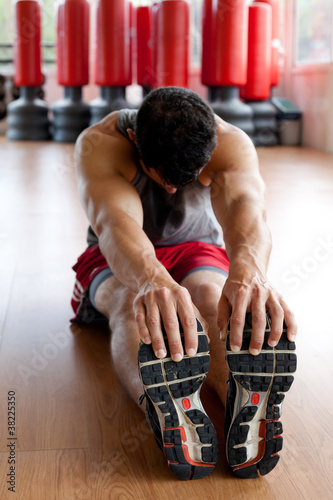 Photo: Muscular man stretching Muscular man stretching