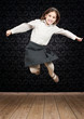 happy little girl jumping in a vintage background