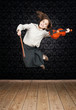 little girl with violin jumping