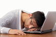 Tired guy sleeping on laptop
